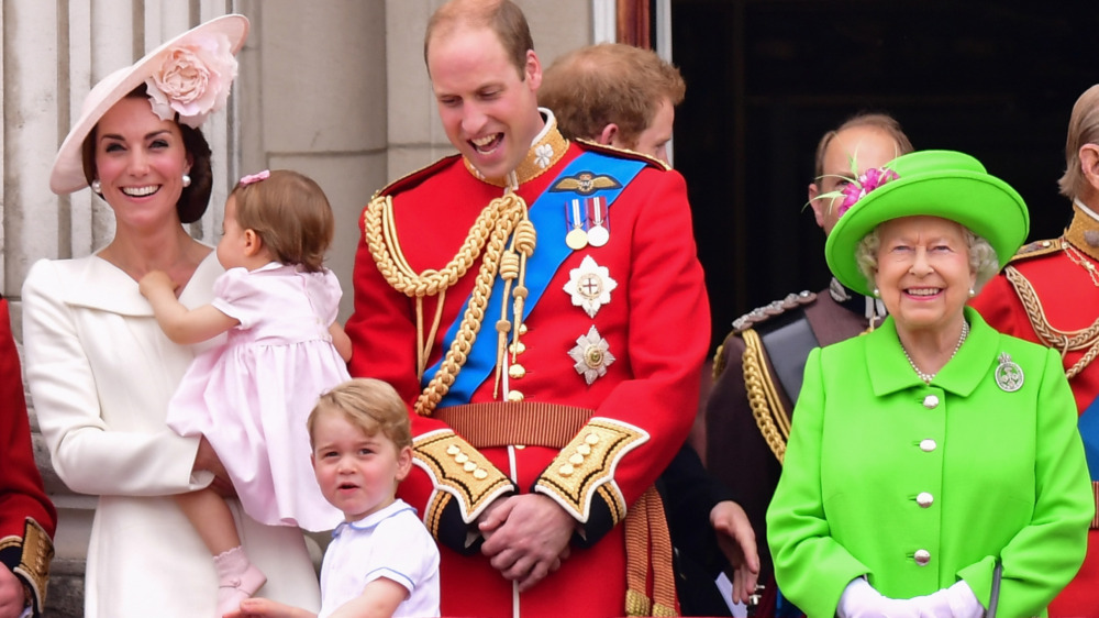 The royal family smiling at event