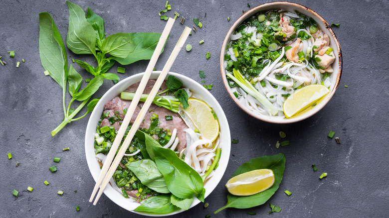 Bowls of pho with chopsticks