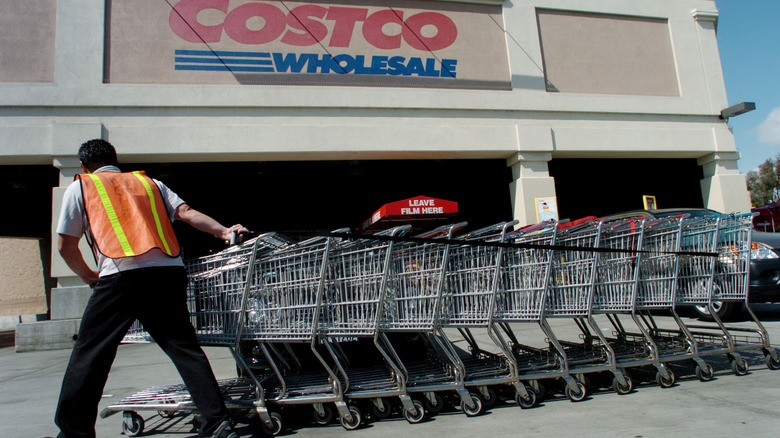 Costco worker rolling carts