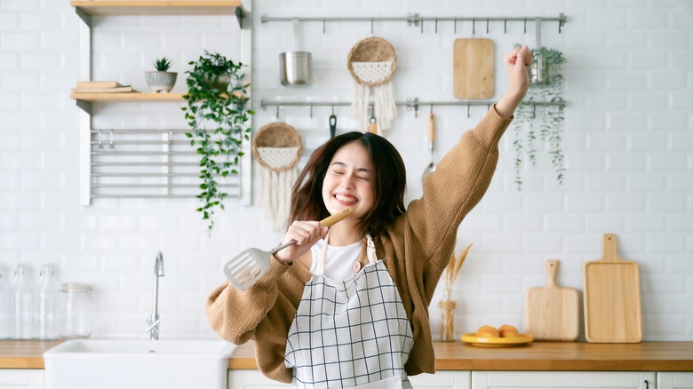 happy woman in kitchen 