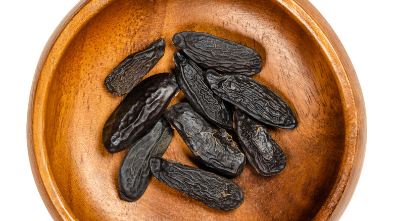 Tonka beans in wooden bowl