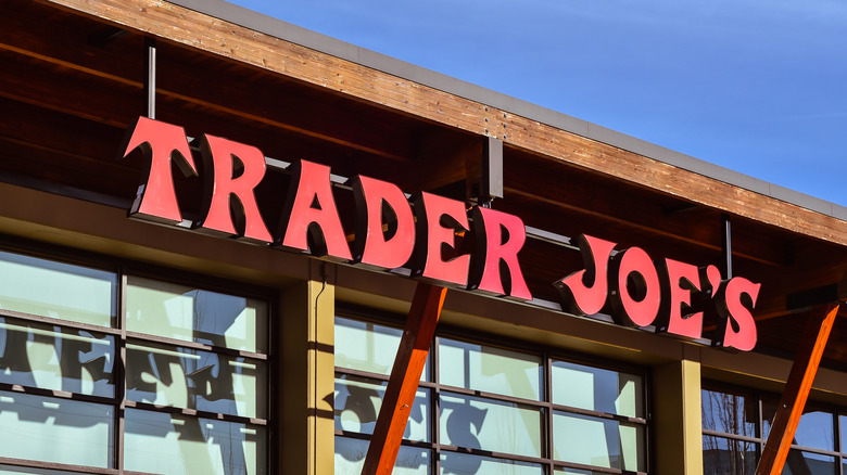 Red Trader Joe's logo against blue sky background