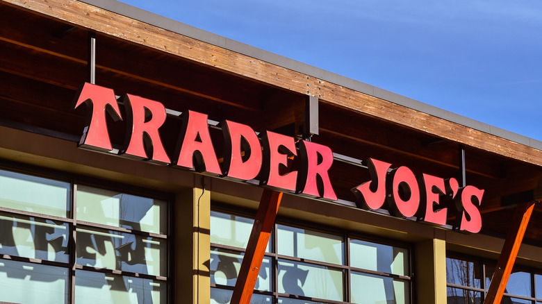 Long lines in Trader Joe's store with people paying at cashier registers