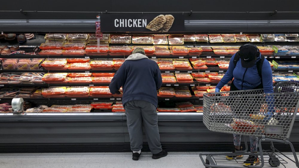 Grocery shelves with meat products