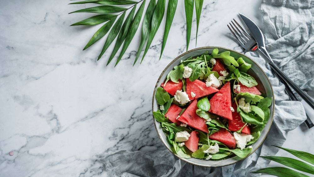 Beautiful watermelon salad with feta, spinach and arugula.