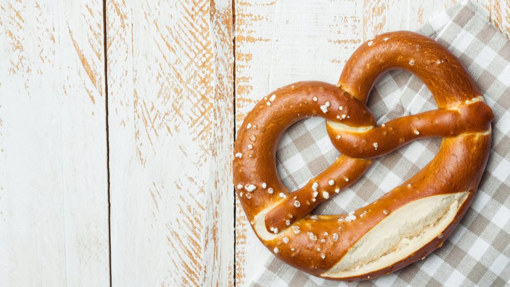 A soft pretzel on a table 