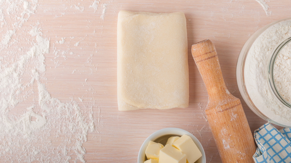 Dough, butter, and rolling pin