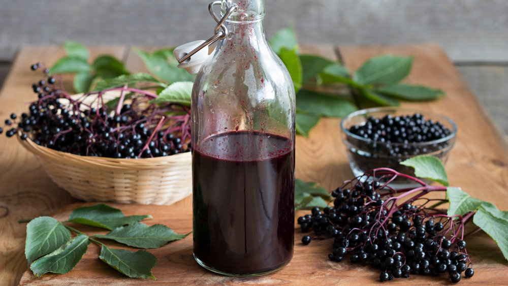 elderberries and bottle of elderberry juice