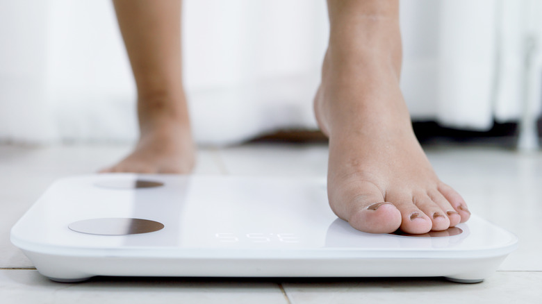 Foot standing on scale