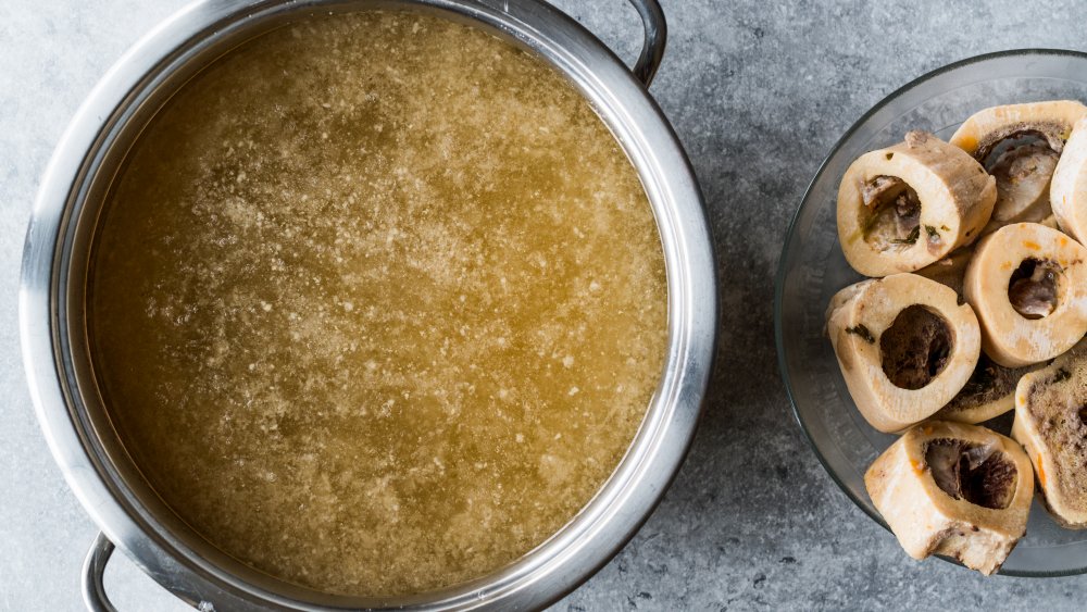 A bowl of bone broth and bones