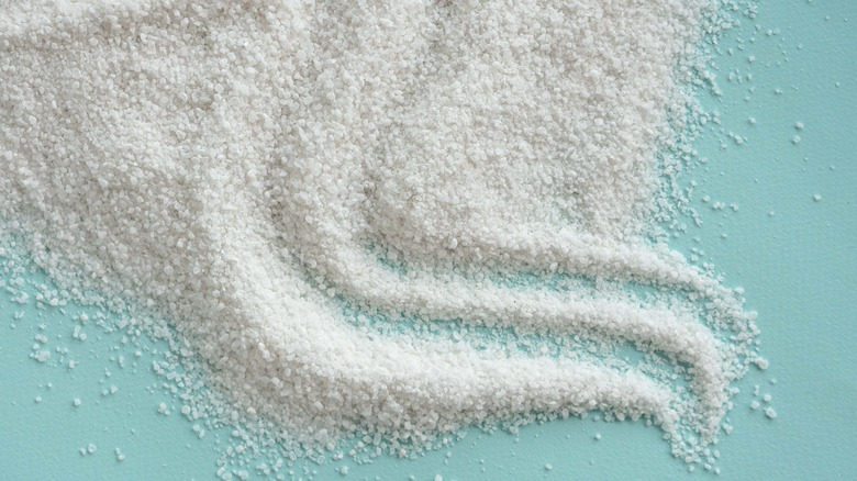 Salt spread across a light blue background