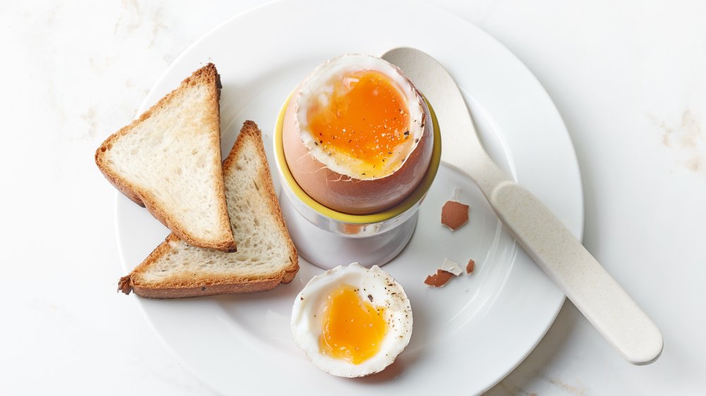 toast points with a soft boiled egg in an egg cup