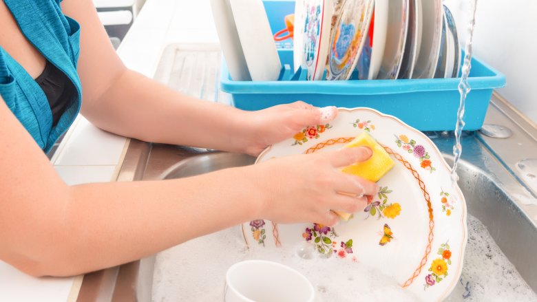 Woman washing dishes