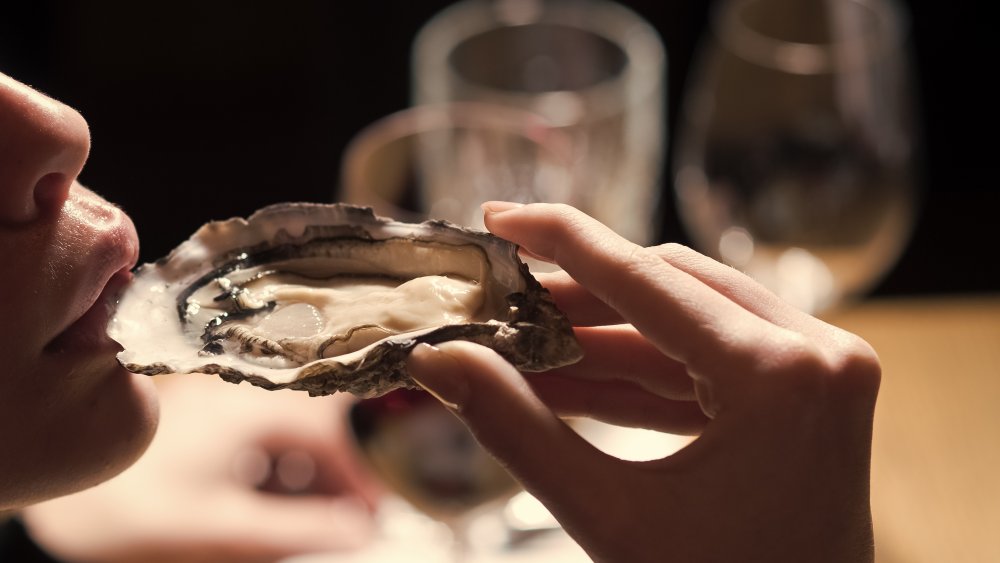 woman eating an oyster