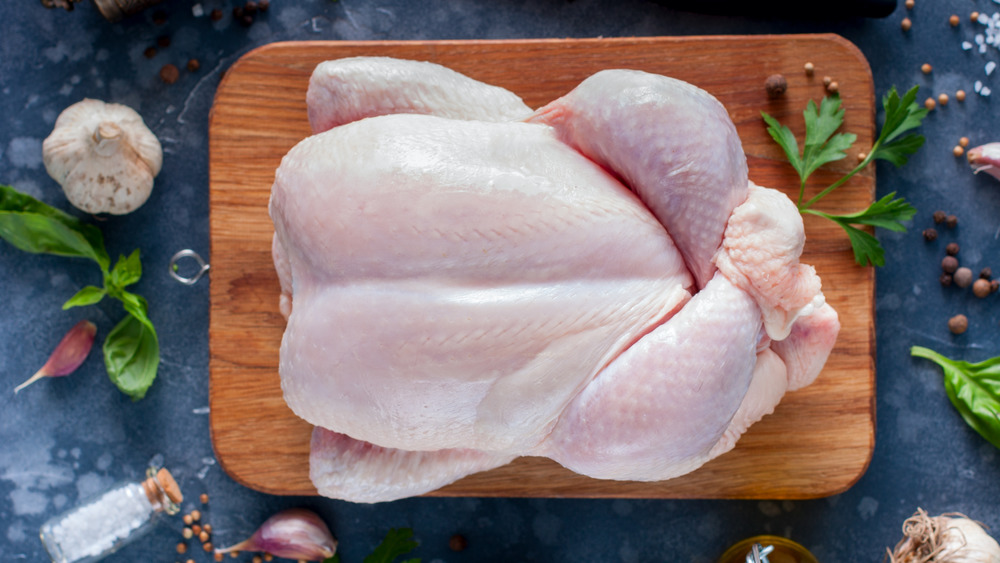 Raw turkey on cutting board
