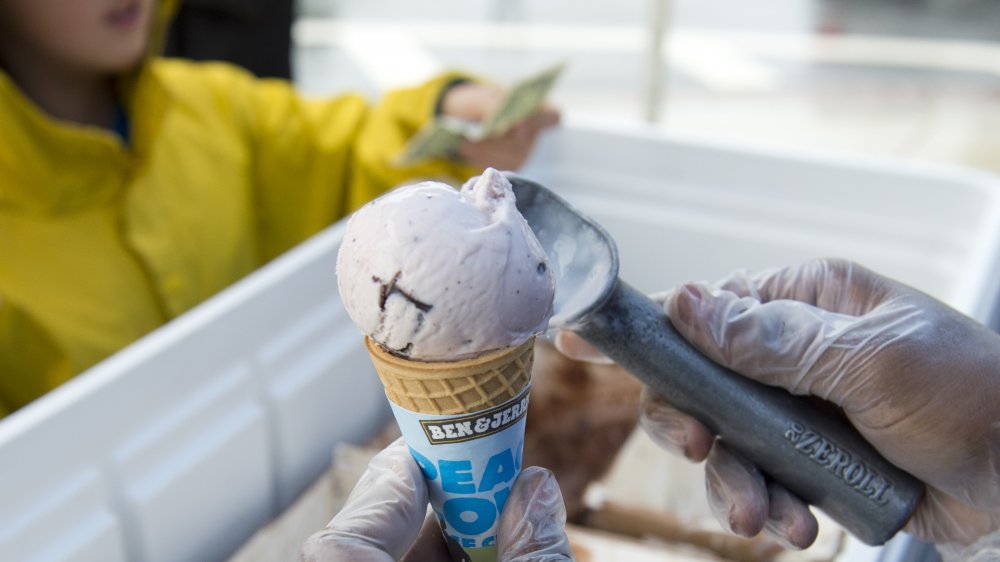 child buying a scoop of ben and jerry's ice cream