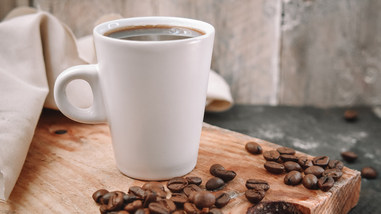 Cup of coffee and coffee beans