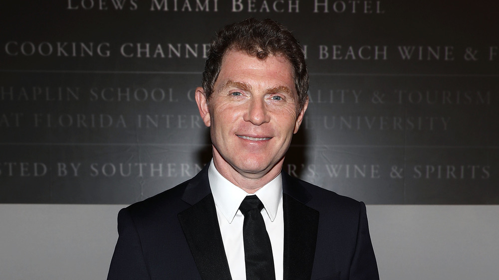 Bobby Flay dressed in a black suit