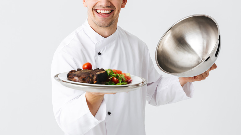 Waiter with cloche plate