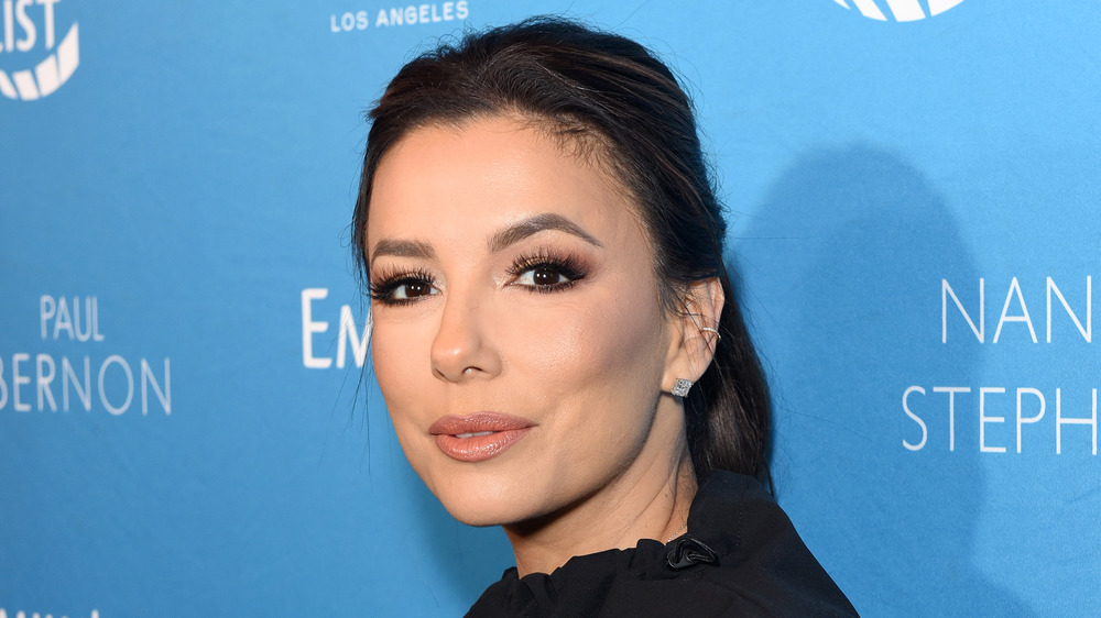 A close-up image of Eva Longoria in black