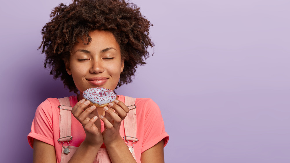 Girl holding a donut