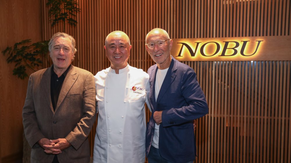 Nobu co-owners pose outside their restaurant