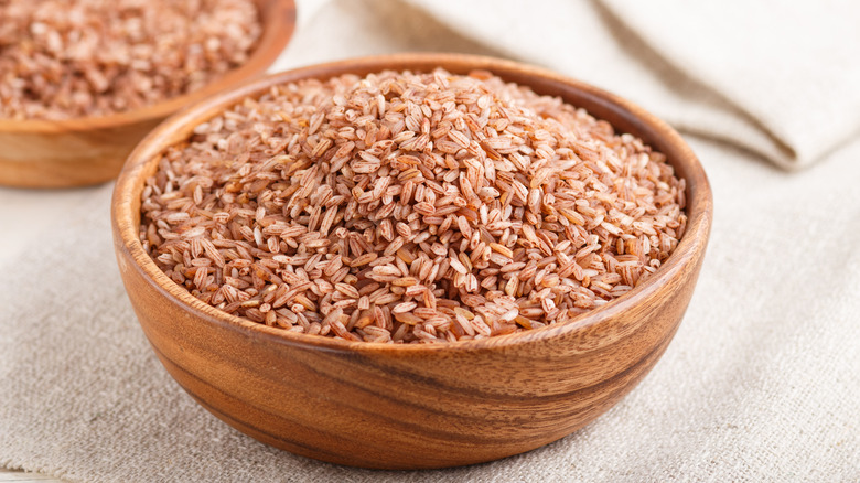 Bowl of brown rice on cloth