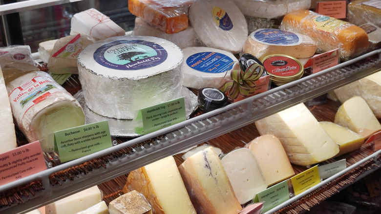 Cheeses in a display case