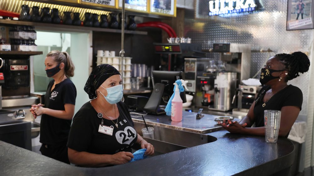 Serving staff wearing masks coronavirus