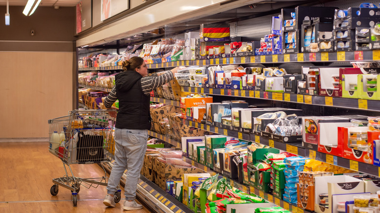 woman shopping for meat at Aldi