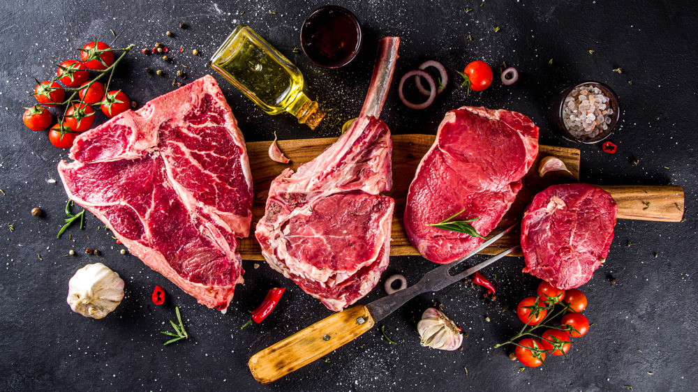 raw steak on a black background