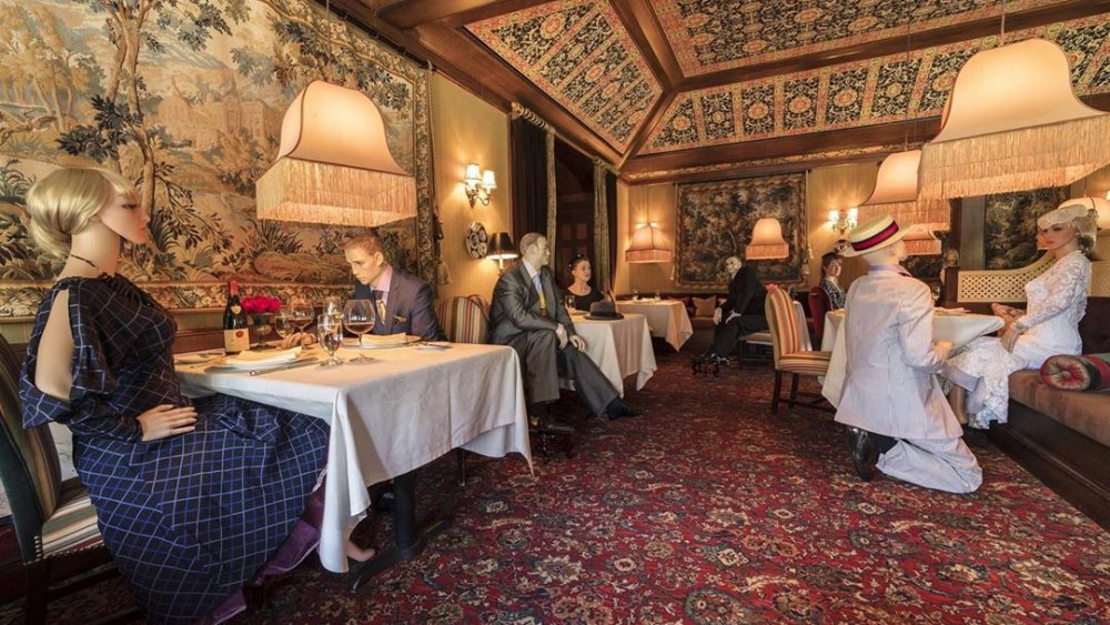 Interior of The Inn at Little Washington with seated mannequins