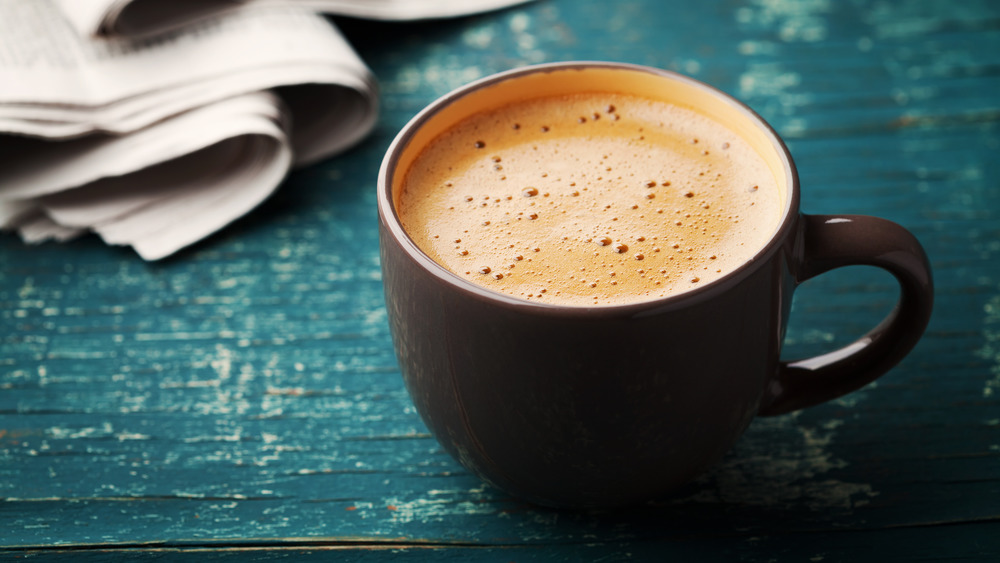 mug with creamy coffee