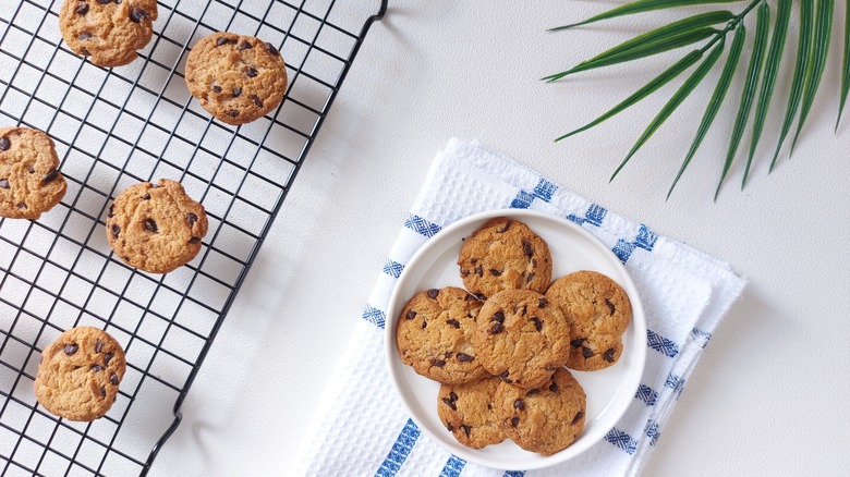 chocolate chip cookies on cooling rack and on a plate