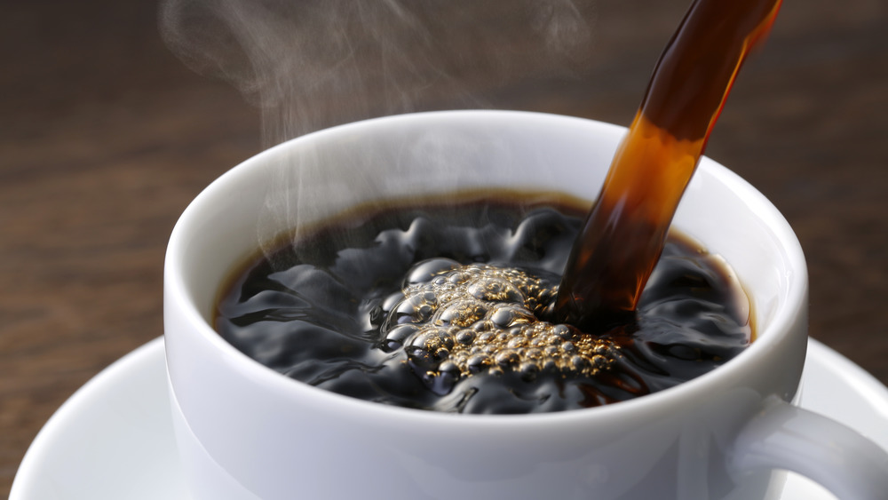 Pouring cup of coffee