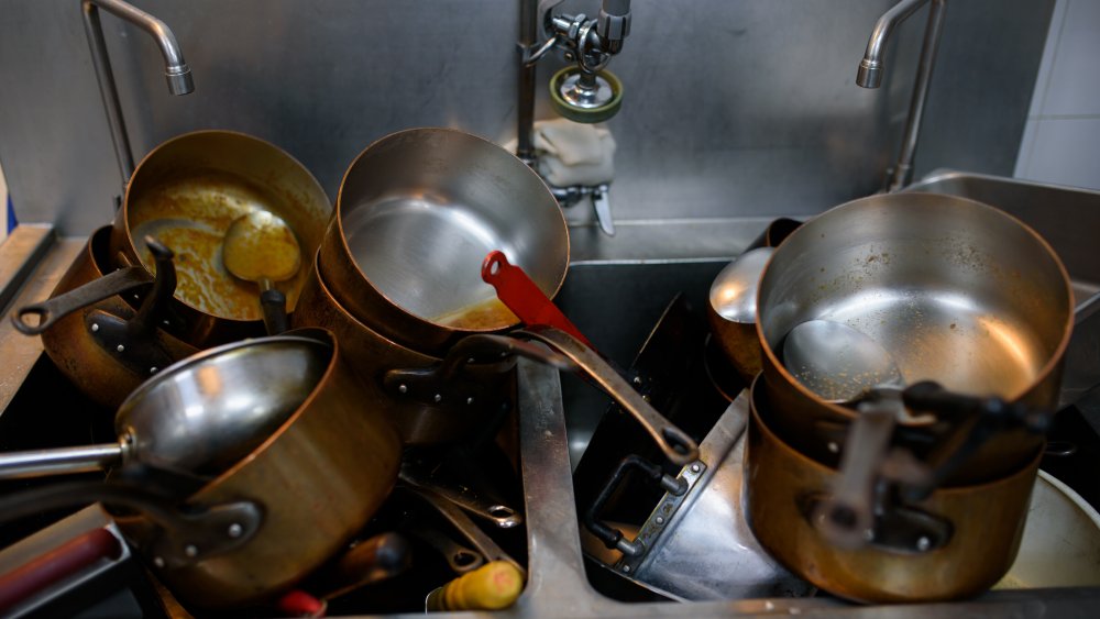 The Reason You Should Never Wash A Hot Pan
