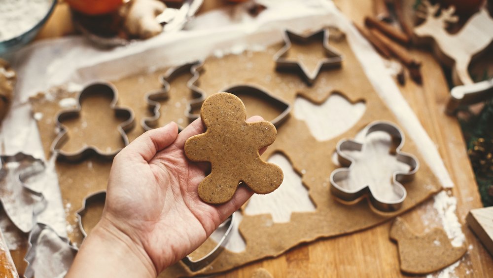 Gingerbread cookies rolled out for cookie cutters