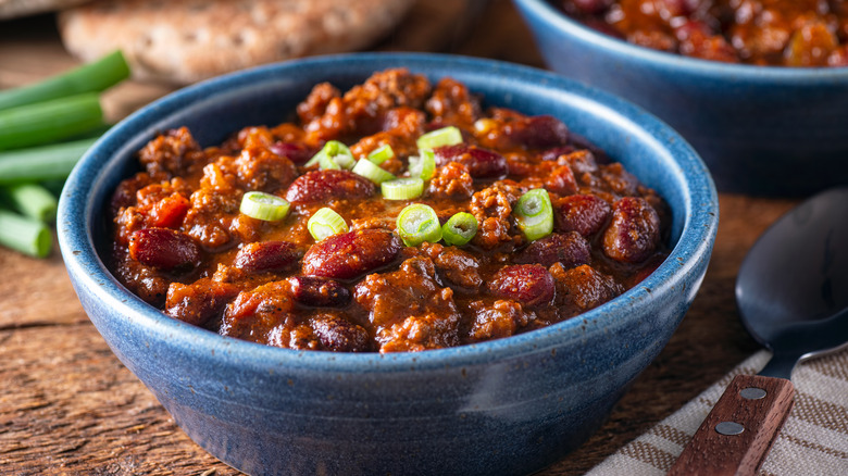 Blue bowl full of meaty chili