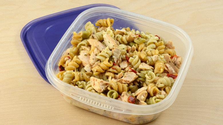 Leftover salmon pasta in a container