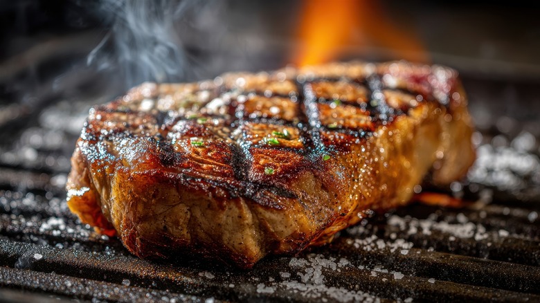 Grilled marinated steak on a grill