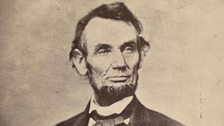 A vintage black-and-white photograph of Abraham Lincoln.