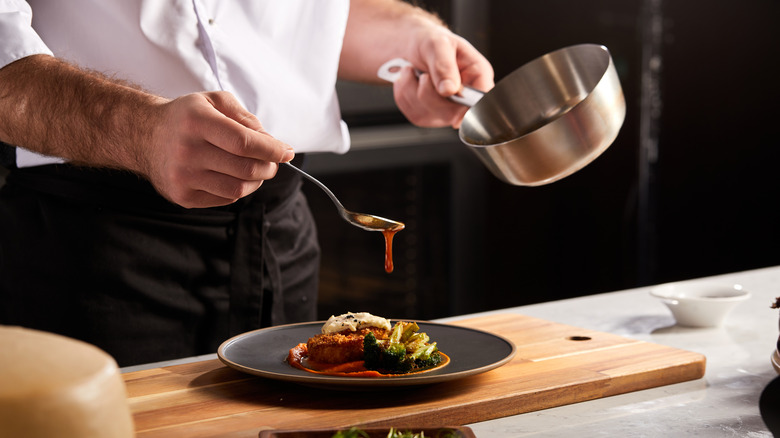 Chef garnishing a dish