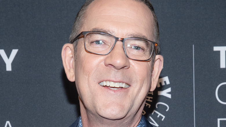 Ted Allen in glasses and smiling