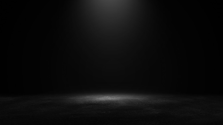 Dark room with spotlight