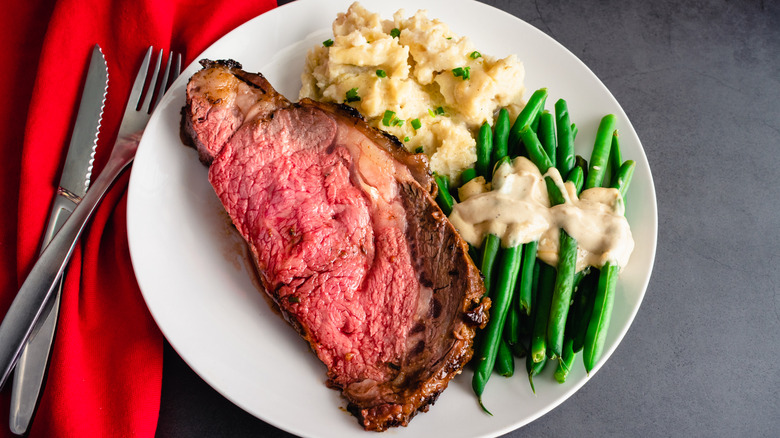 Roasted prime rib with mashed potatoes and green beans