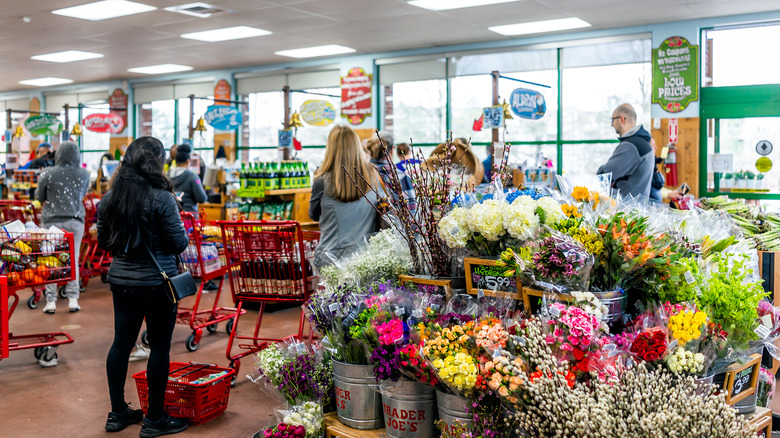 a line of people at trader joe's