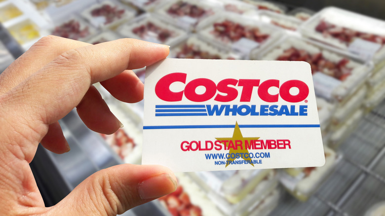 Hand holding Costco card