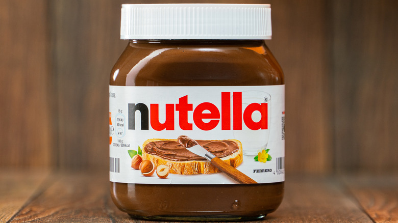 Nutella jar with wood background