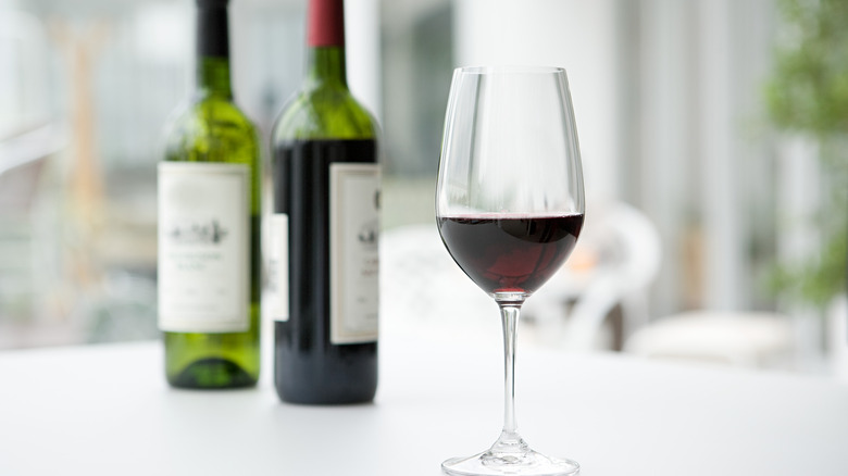 red wine bottles and glass