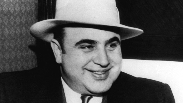 Al Capone sitting in a chair